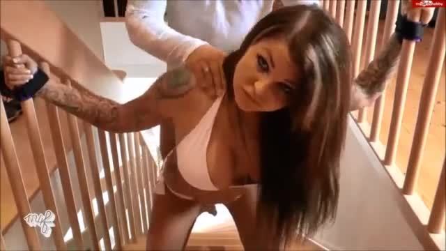 Busty tattooed brunette tied and fucked on the stairs