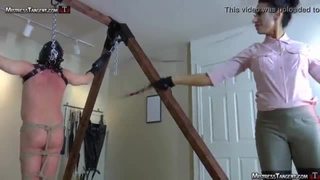 Hooded femdom slave is whipped and stomped by tangent